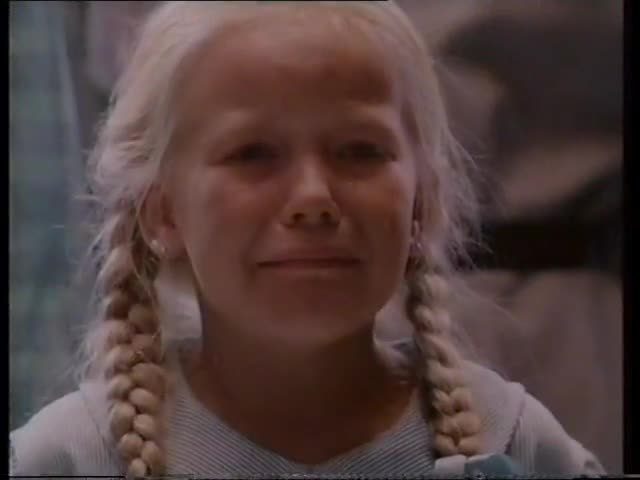 Still from the 1987 Grim Reaper campaign: a young girl in plaits, one of the pins, looking down the lane.